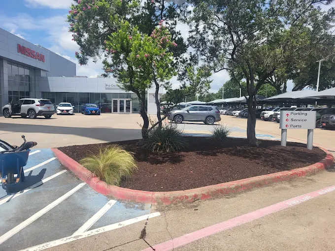 Commercial landscape flower bed along a parking lot