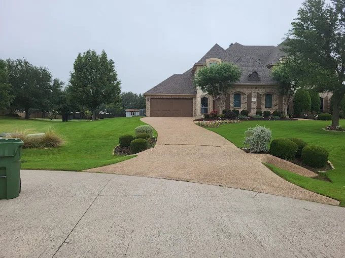 Lush green lawn leading to a well-maintained Lewisville home