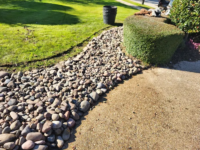 Decorative rock and river bed feature in a garden landscape